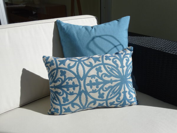 Amalfi Steel Blue and Steel Blue Sunbrella outdoor cushions on couch