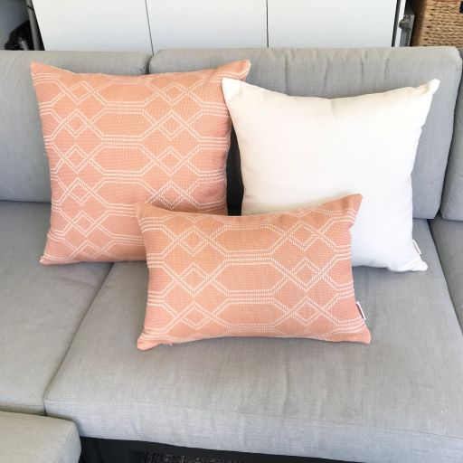 Sunbrella Outdoor Cushion Navajo Apricot Group on couch